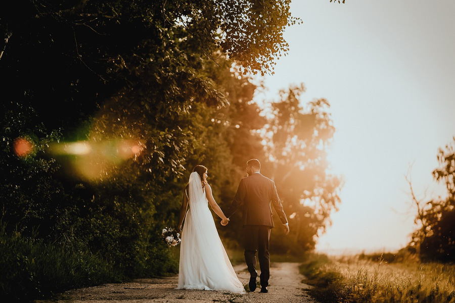 Bride and groom walking away